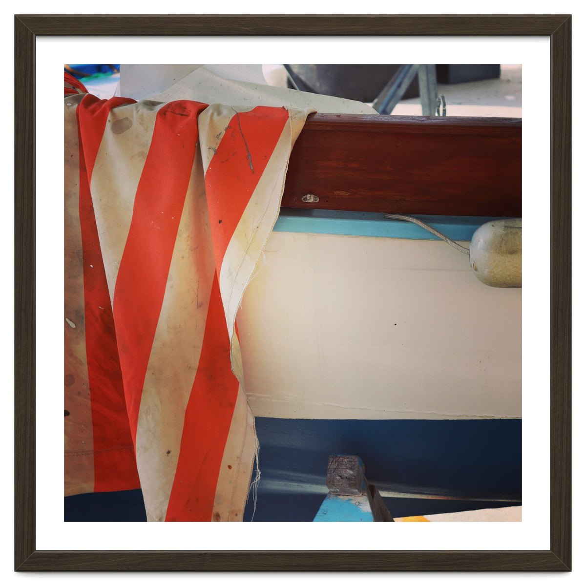 Fishing boat and striped sail