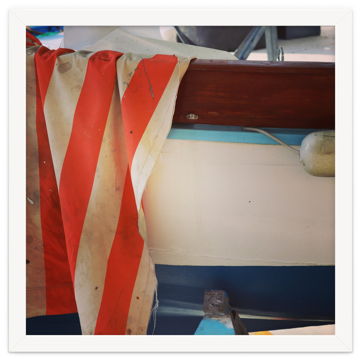 Fishing boat and striped sail