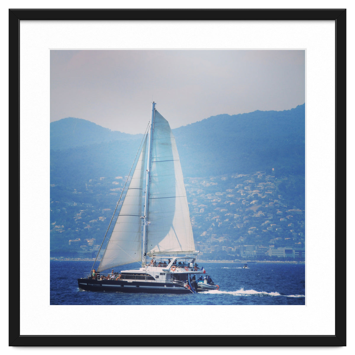 Modern yacht with white sails