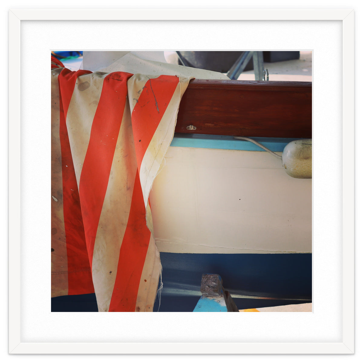 Fishing boat and striped sail