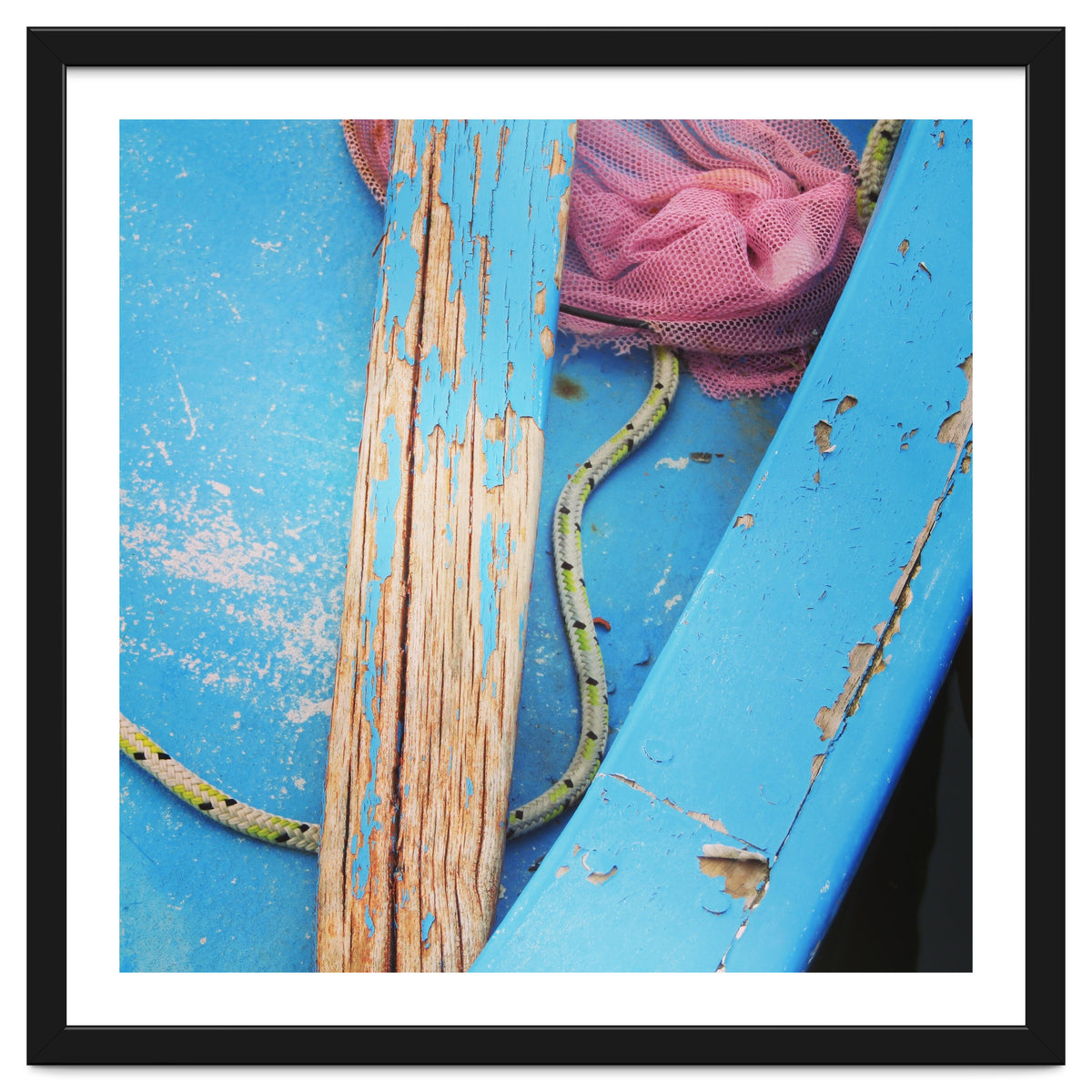 Weathered boat, sail and oar
