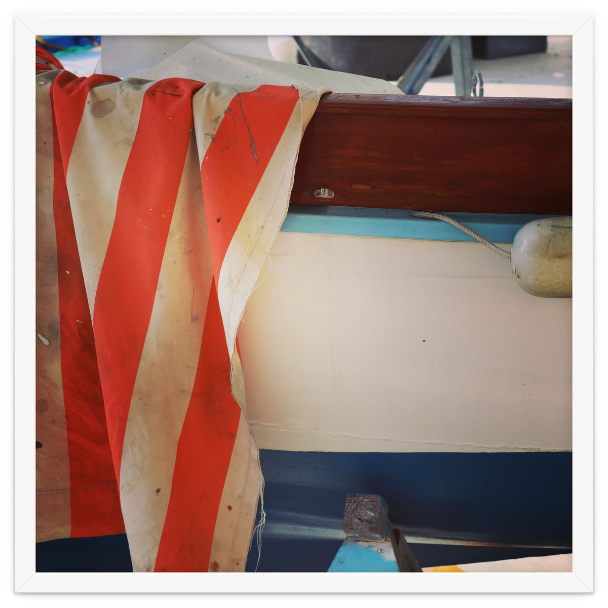 Fishing boat and striped sail