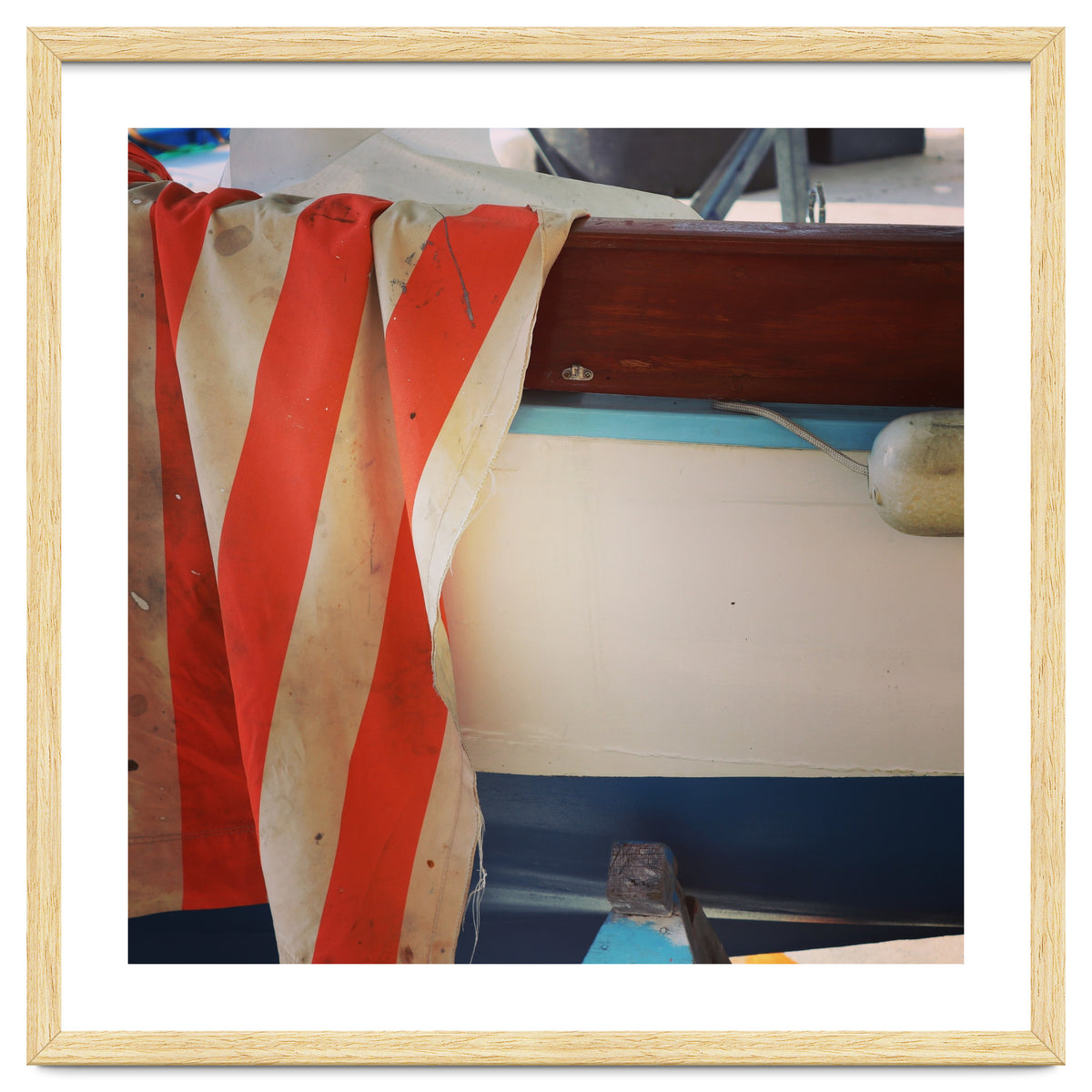 Fishing boat and striped sail