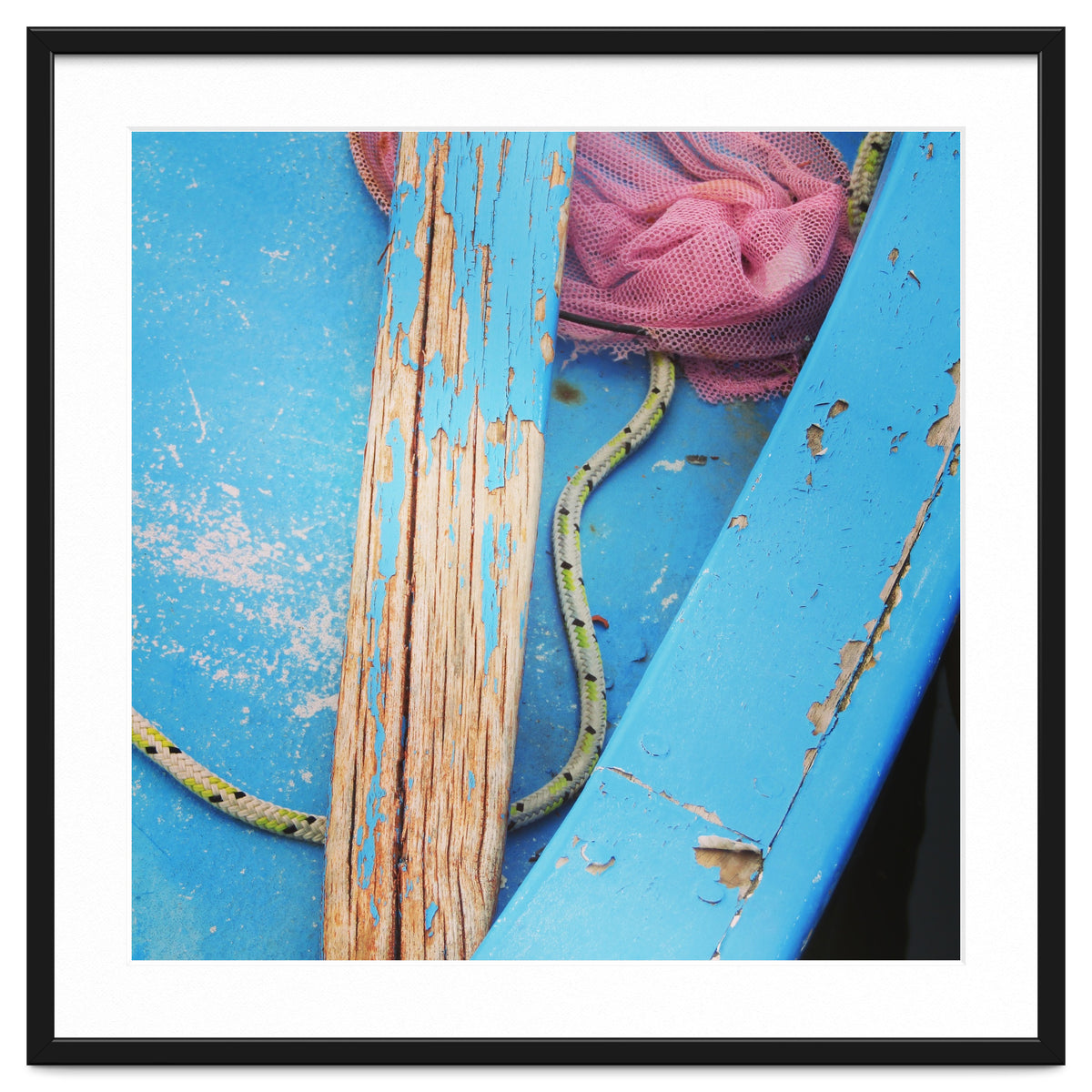 Weathered boat, sail and oar