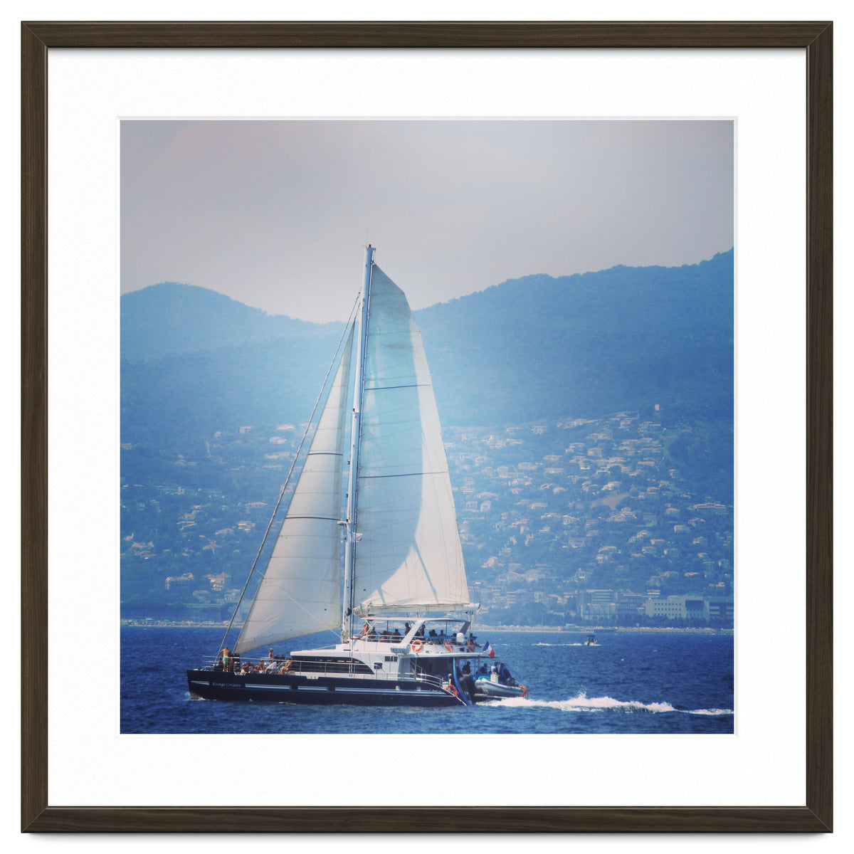 Modern yacht with white sails