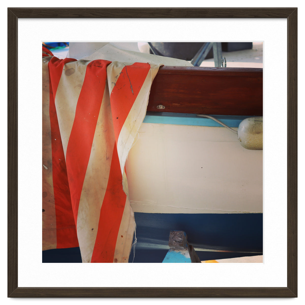 Fishing boat and striped sail