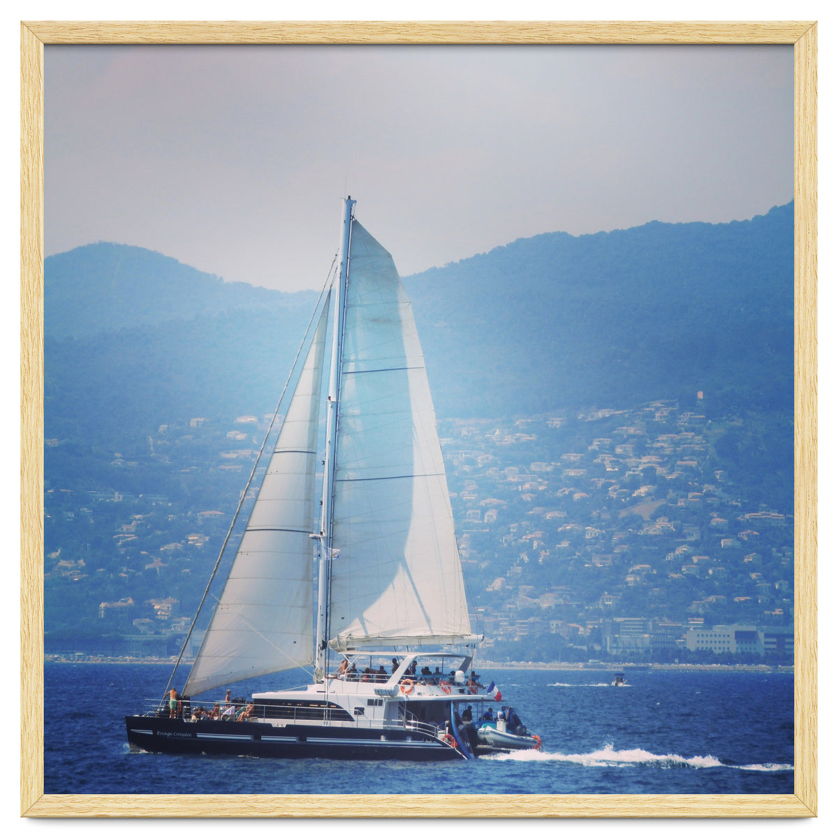 Modern yacht with white sails