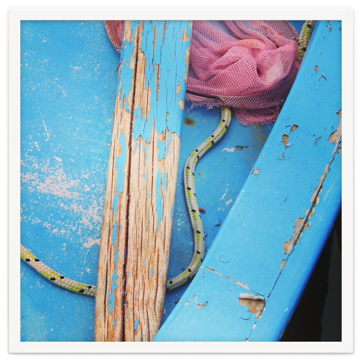 Weathered boat, sail and oar