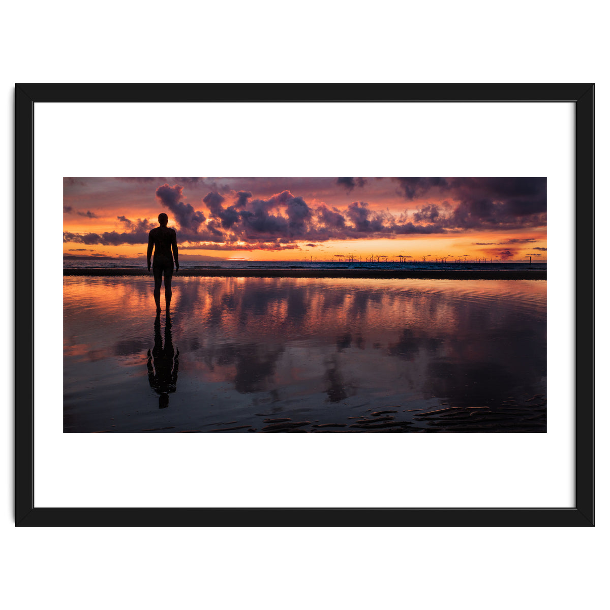 Sunset at Another Place - Sir Antony Gormley statues at Crosby Beach in Merseyside, England.