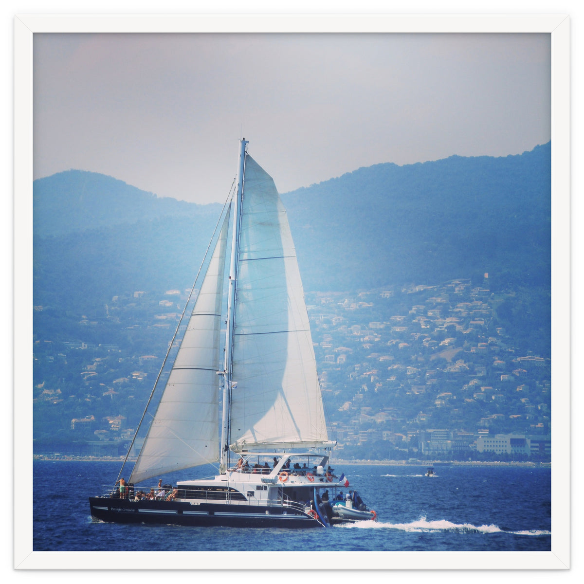 Modern yacht with white sails