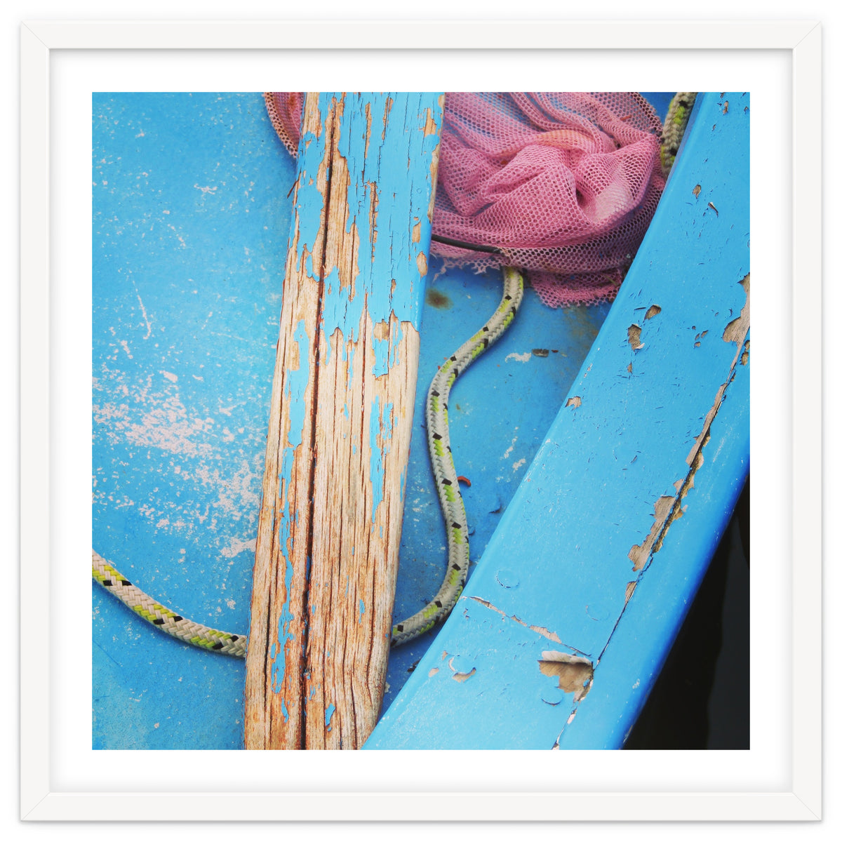 Weathered boat, sail and oar