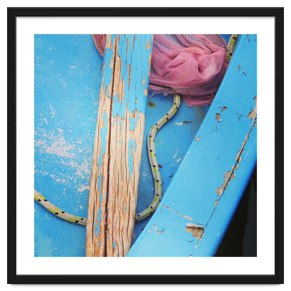 Weathered boat, sail and oar
