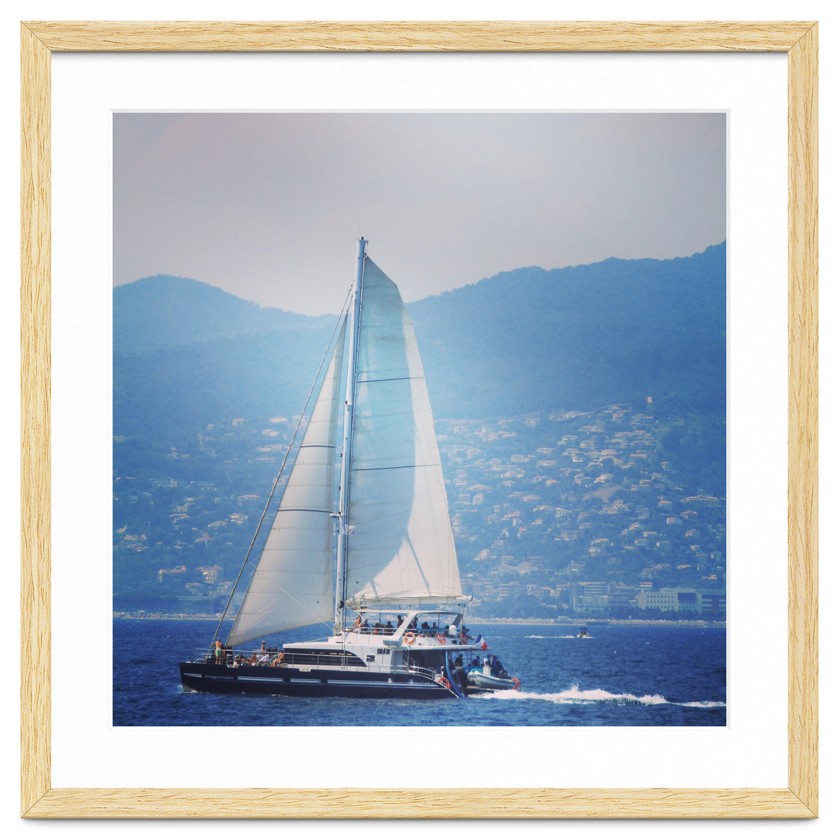 Modern yacht with white sails