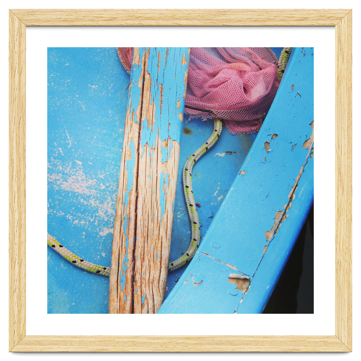 Weathered boat, sail and oar