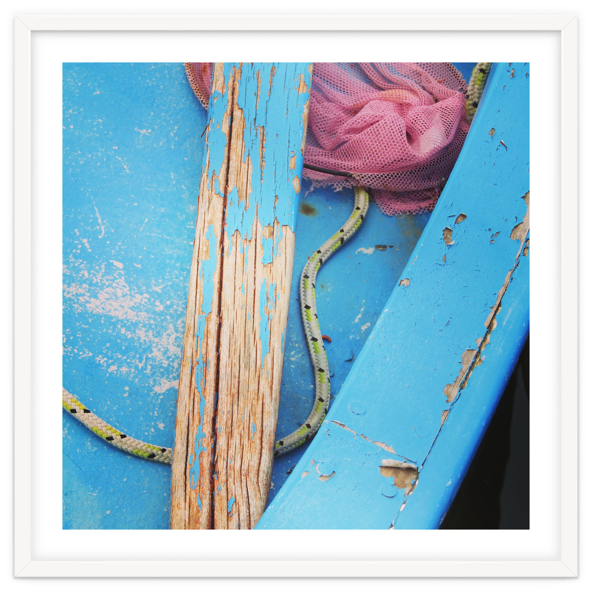 Weathered boat, sail and oar