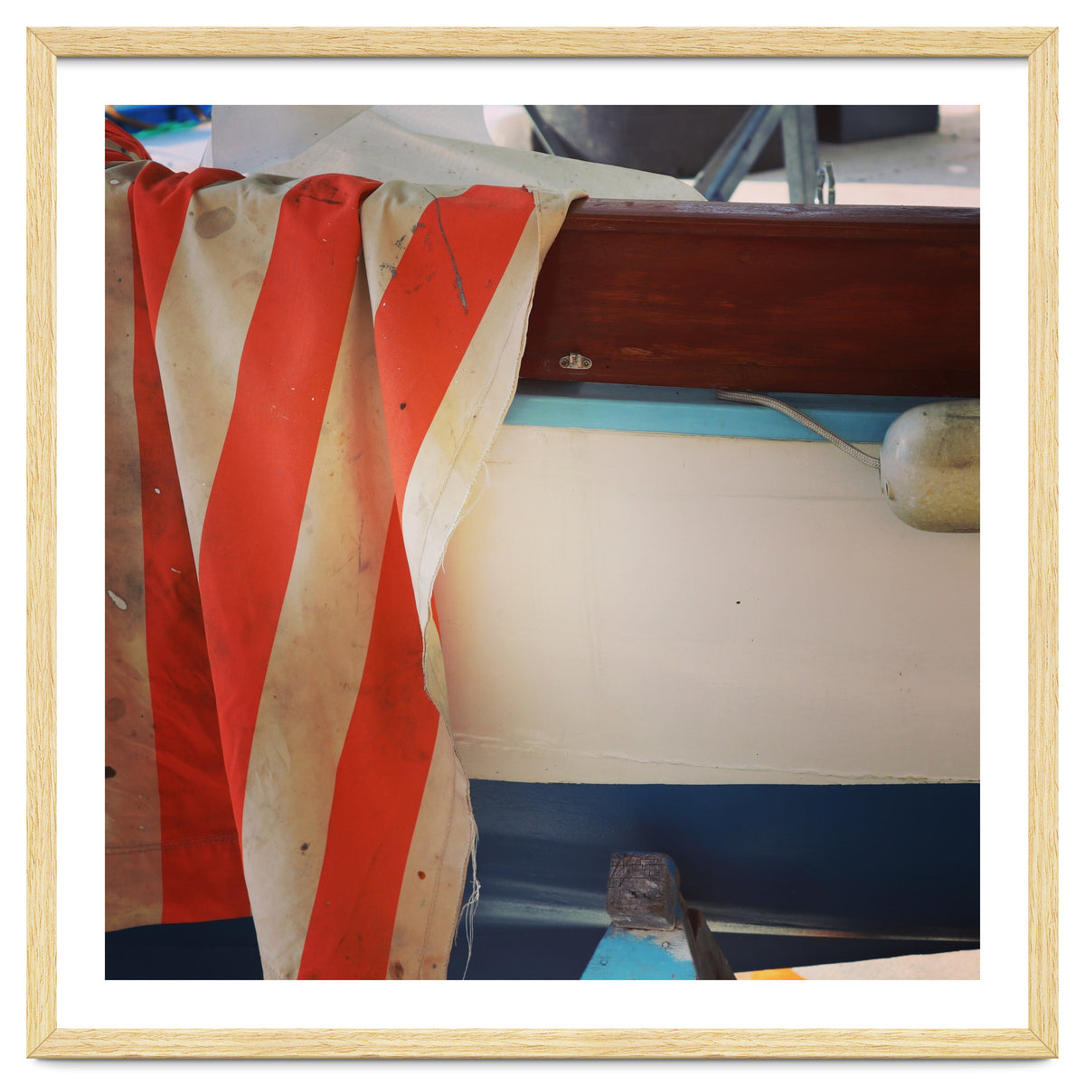 Fishing boat and striped sail